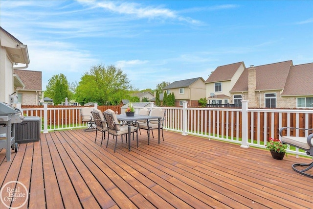 49204 Stratford Dr, Chesterfield Twp, MI 48047 - wooden deck featuring a residential view, outdoor dining area, and a fenced backyard