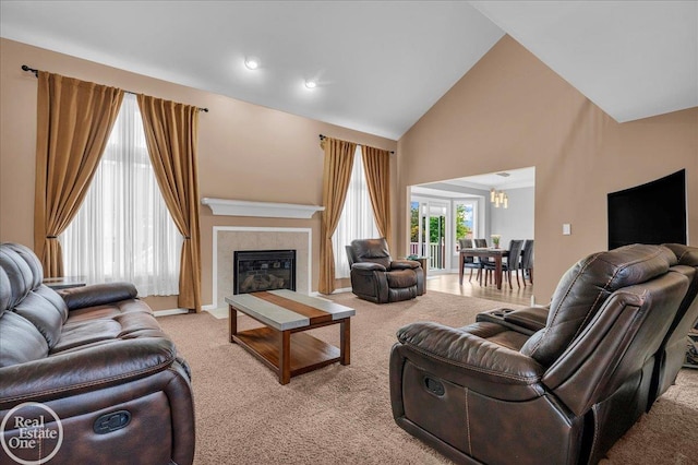 49204 Stratford Dr, Chesterfield Twp, MI 48047 - carpeted living area with a chandelier, high vaulted ceiling, and a fireplace