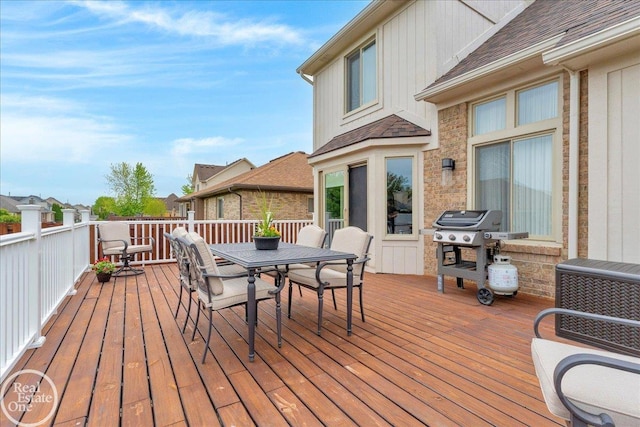 49204 Stratford Dr, Chesterfield Twp, MI 48047 - wooden deck featuring outdoor dining area and grilling area