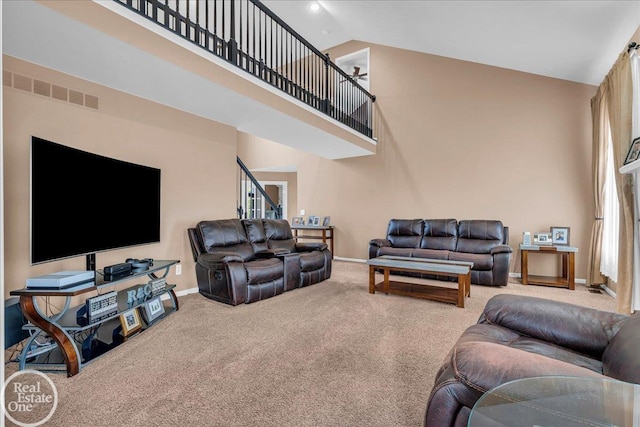 49204 Stratford Dr, Chesterfield Twp, MI 48047 - carpeted living room featuring high vaulted ceiling and baseboards
