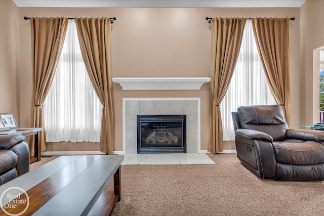 49204 Stratford Dr, Chesterfield Twp, MI 48047 - carpeted living room featuring a tile fireplace, plenty of natural light, and baseboards