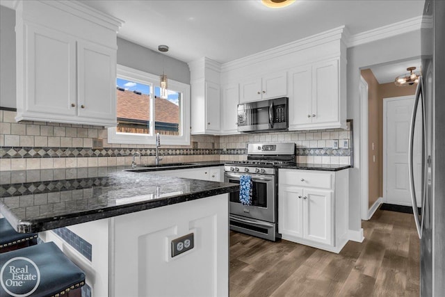 49204 Stratford Dr, Chesterfield Twp, MI 48047 - kitchen featuring stainless steel appliances, a sink, a peninsula, white cabinetry, and ornamental molding