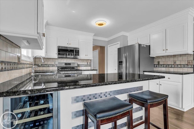 49204 Stratford Dr, Chesterfield Twp, MI 48047 - kitchen featuring appliances with stainless steel finishes, a sink, tasteful backsplash, white cabinetry, and dark stone counters