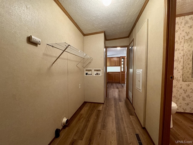 104 Pine St, Greenland, MI 49929 - washroom featuring wood finished floors, hookup for a washing machine, crown molding, and a textured ceiling