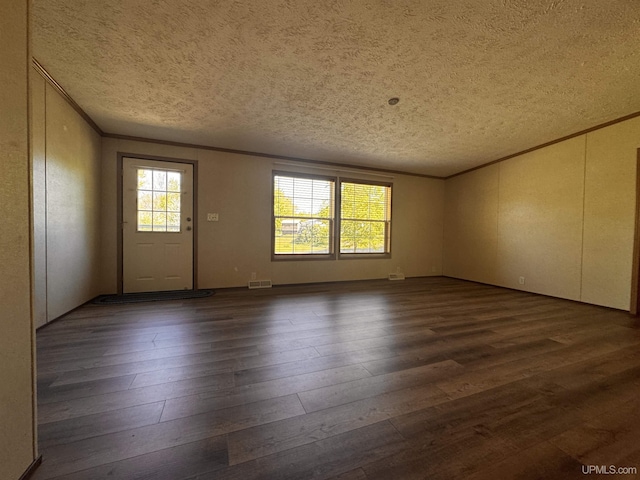 104 Pine St, Greenland, MI 49929 - unfurnished room featuring ornamental molding, a textured ceiling, and dark wood-style flooring