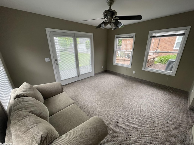 2029 Manchester Rd, Grosse Pointe Woods, MI 48236 - living area featuring plenty of natural light, a ceiling fan, light carpet, and baseboards
