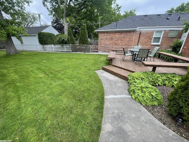2029 Manchester Rd, Grosse Pointe Woods, MI 48236 - view of yard with a wooden deck and outdoor dining area