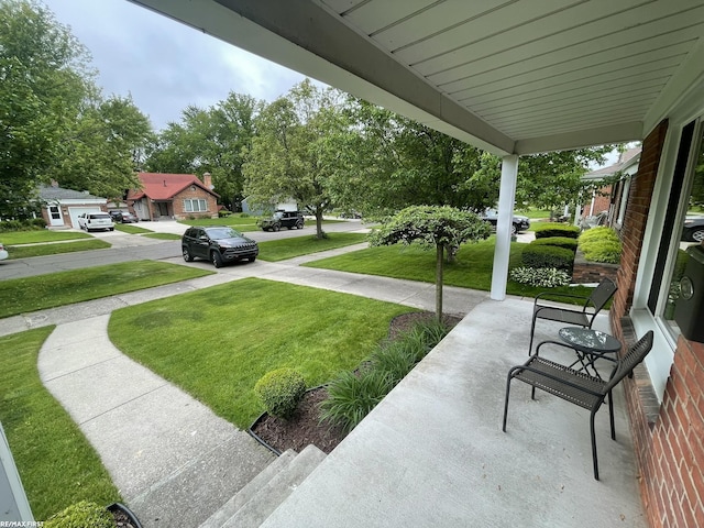 2029 Manchester Rd, Grosse Pointe Woods, MI 48236 - porch with a yard