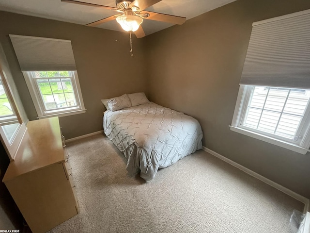 2029 Manchester Rd, Grosse Pointe Woods, MI 48236 - carpeted bedroom with baseboards and a ceiling fan