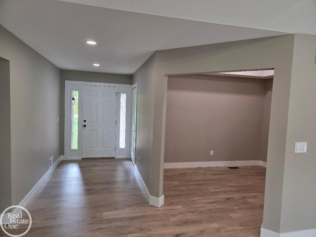 53340 Washington St, New Baltimore, MI 48047 - entryway with wood finished floors, baseboards, and recessed lighting