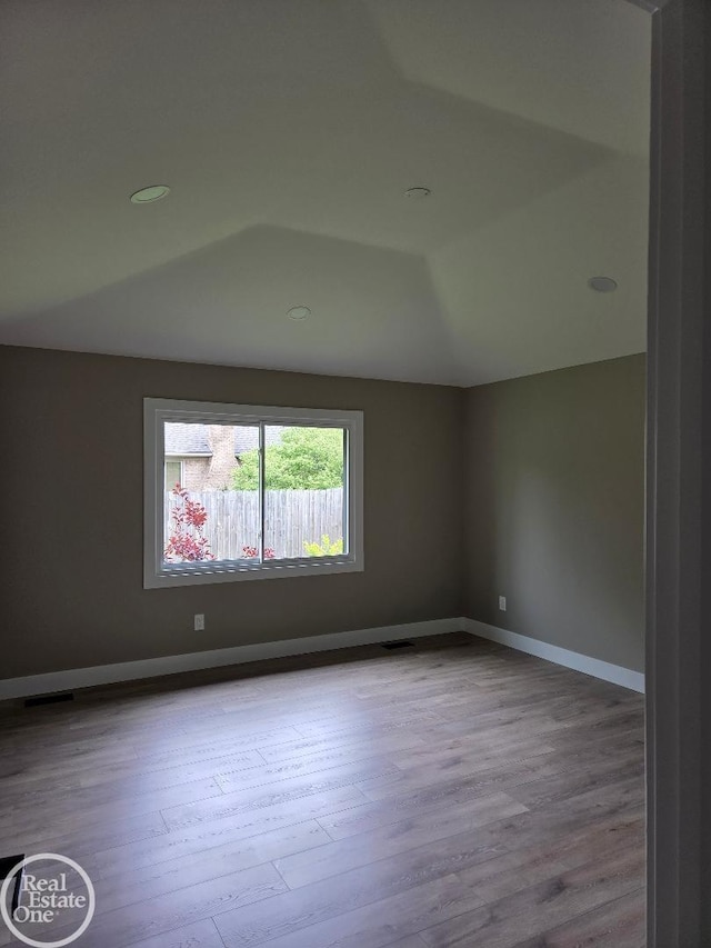 53340 Washington St, New Baltimore, MI 48047 - unfurnished room featuring wood finished floors, baseboards, and recessed lighting