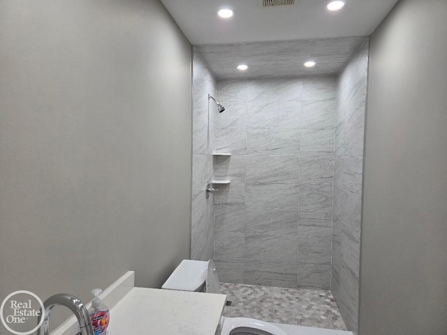 53340 Washington St, New Baltimore, MI 48047 - full bath with recessed lighting, a tile shower, toilet, and vanity