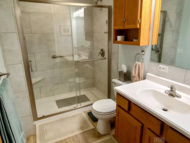 1750 Castleview Ct, Gladwin, MI 48624 - bathroom featuring toilet, a stall shower, and vanity