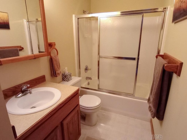 1750 Castleview Ct, Gladwin, MI 48624 - bathroom with vanity, toilet, and bath / shower combo with glass door