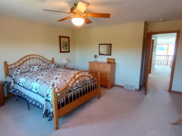 1750 Castleview Ct, Gladwin, MI 48624 - bedroom with carpet floors, a ceiling fan, and baseboards