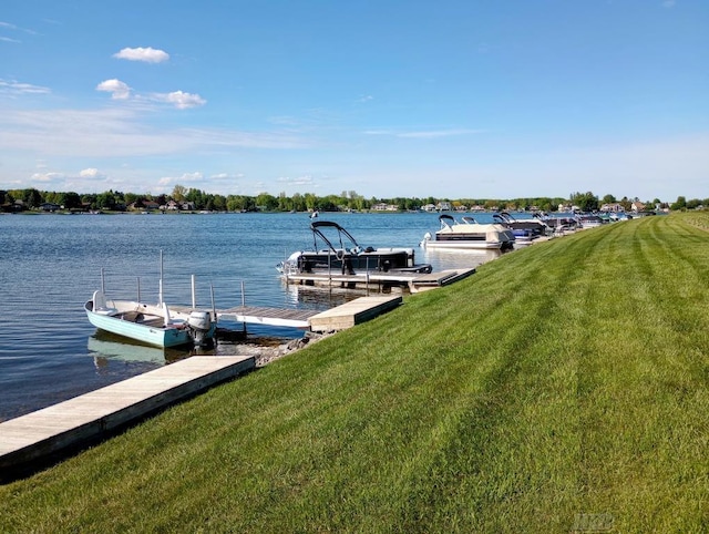 1750 Castleview Ct, Gladwin, MI 48624 - dock with a lawn and a water view