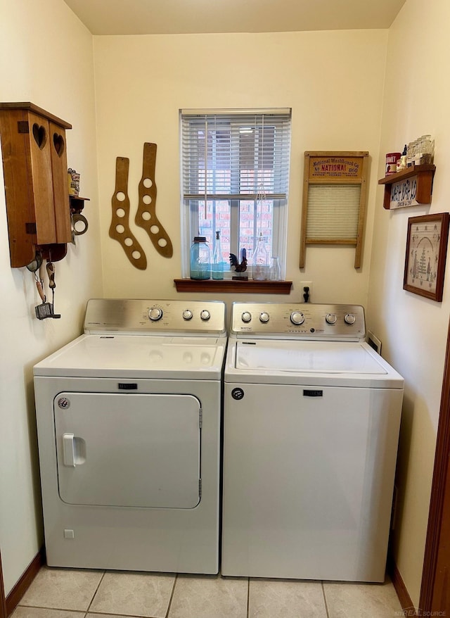 5408 Holy Cross Ct, Warren, MI 48091 - washroom with independent washer and dryer, light tile patterned floors, and baseboards
