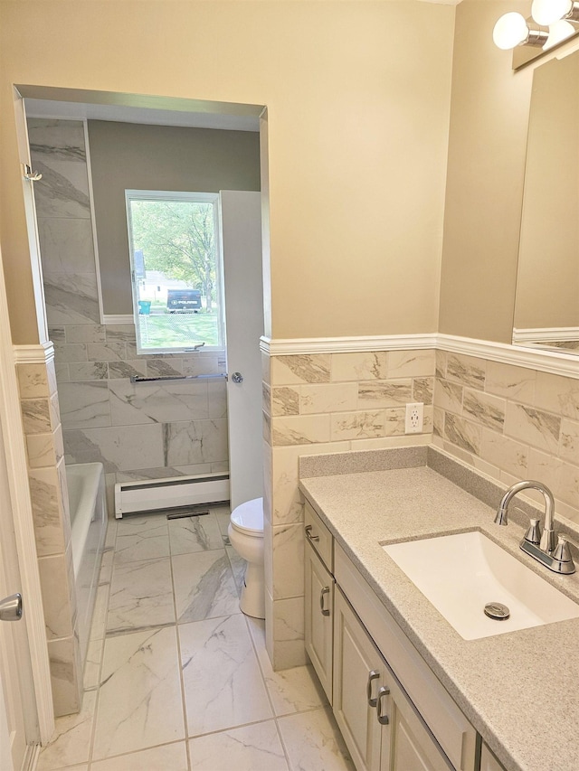 3045 W Birch Dr, Bay City, MI 48706 - bathroom with baseboard heating, tile walls, marble look tile flooring, toilet, and vanity