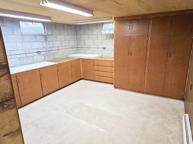 3045 W Birch Dr, Bay City, MI 48706 - below grade area featuring baseboard heating and concrete block wall