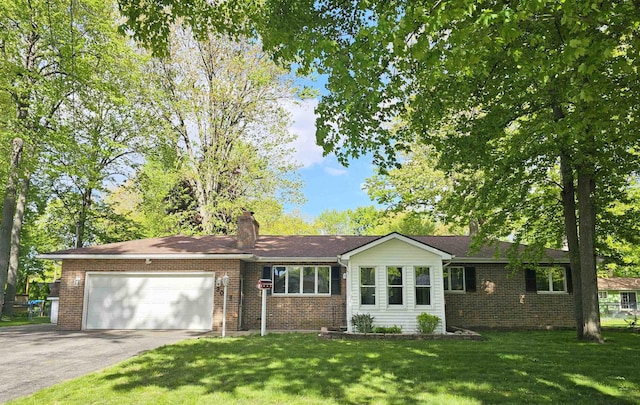 3045 W Birch Dr, Bay City, MI 48706 - ranch-style home with driveway, a garage, brick siding, a chimney, and a front lawn