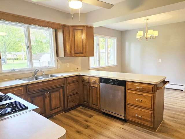 3045 W Birch Dr, Bay City, MI 48706 - kitchen with dishwasher, a peninsula, baseboard heating, a chandelier, and light wood-style floors