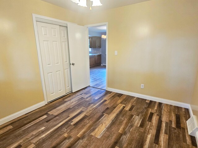 3045 W Birch Dr, Bay City, MI 48706 - unfurnished room featuring dark wood-style flooring and baseboards