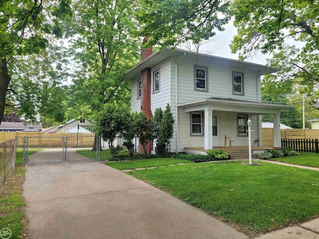 730 Jenkinson St, Port Huron, MI 48060 - american foursquare style home featuring a chimney, a porch, and a gate