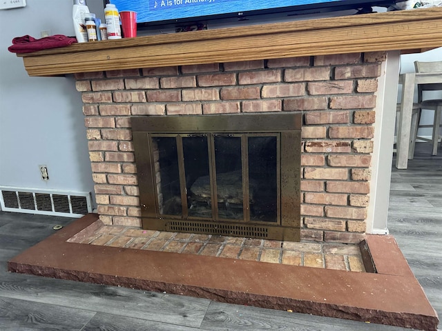 5431 Threasa St, Saginaw, MI 48603 - detailed view of a brick fireplace and wood finished floors