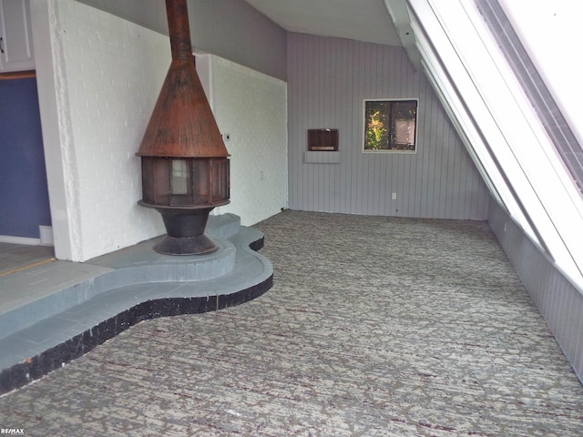 21102 Lancaster St, Harper Woods, MI 48225 - bonus room featuring carpet and a wood stove
