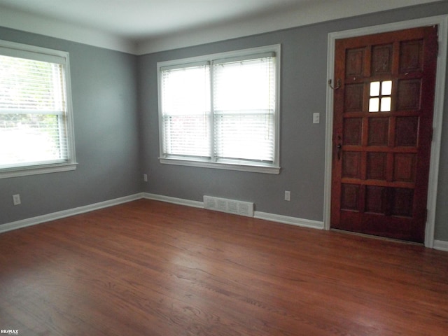 21102 Lancaster St, Harper Woods, MI 48225 - entryway featuring plenty of natural light, wood finished floors, and baseboards