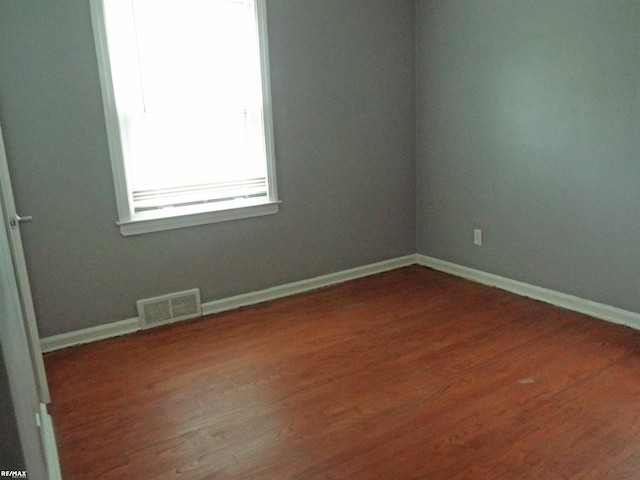 21102 Lancaster St, Harper Woods, MI 48225 - unfurnished room featuring wood finished floors and baseboards