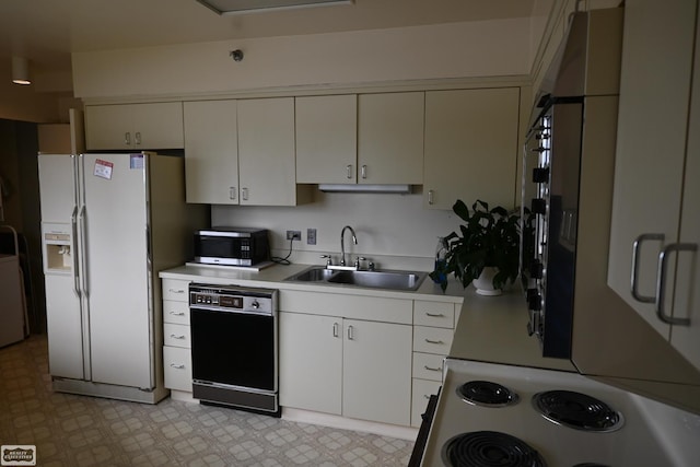5000 Town Ctr Unit 801, Southfield, MI 48075 - kitchen with white appliances, a sink, light countertops, light floors, and white cabinetry