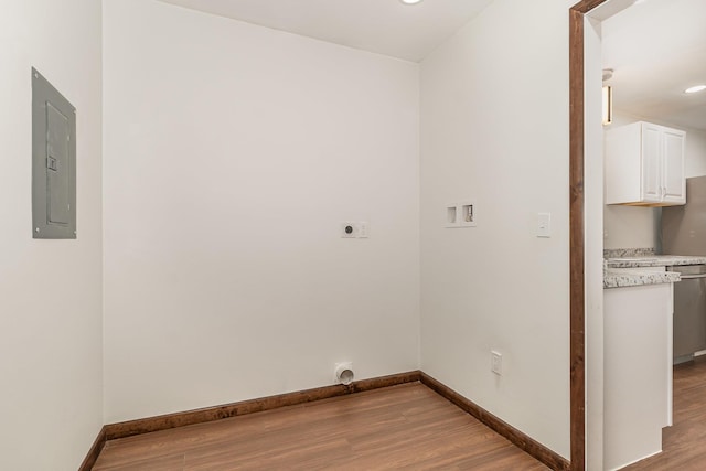 2695 Hupter Rd, Pinconning, MI 48650 - washroom with hookup for an electric dryer, electric panel, hookup for a washing machine, wood finished floors, and recessed lighting