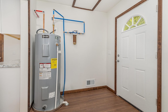 2695 Hupter Rd, Pinconning, MI 48650 - utility room featuring water heater