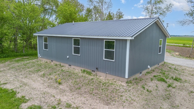 2695 Hupter Rd, Pinconning, MI 48650 - view of side of property featuring metal roof and crawl space