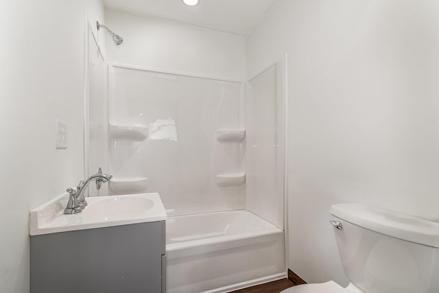 2695 Hupter Rd, Pinconning, MI 48650 - bathroom featuring vanity, toilet, and shower / bathtub combination