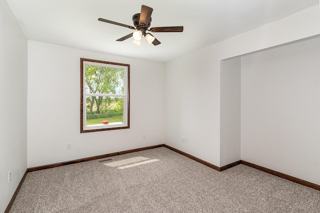 2695 Hupter Rd, Pinconning, MI 48650 - empty room with carpet, ceiling fan, and baseboards