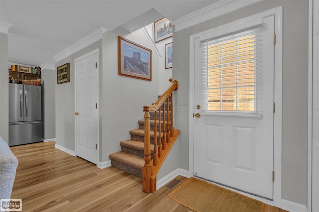 4916 Royal Cove Dr, Shelby Twp, MI 48316 - foyer entrance featuring ornamental molding, light wood finished floors, baseboards, and stairway