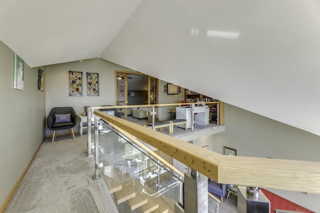 7346 Huron Ave Unit 302 Building B, Lexington, MI 48450 - corridor with baseboards, vaulted ceiling, carpet flooring, and an upstairs landing