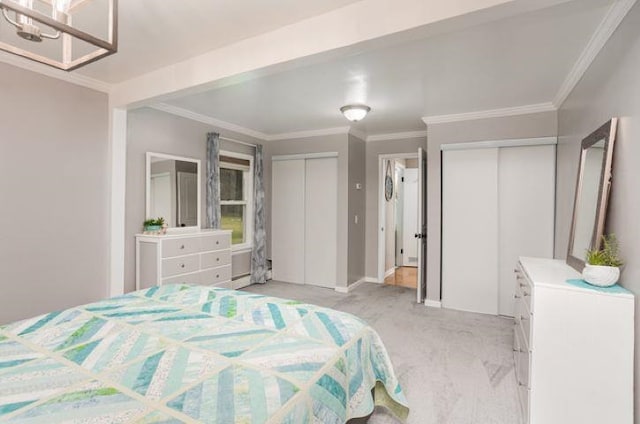 4449 S M 18 Hwy, Beaverton, MI 48612 - bedroom featuring multiple closets, crown molding, baseboards, and a chandelier