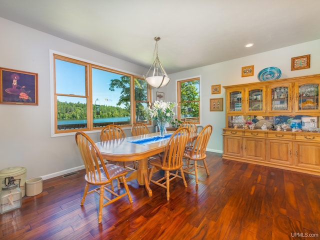 217 Shoreline Dr, Negaunee, MI 49866 - dining area with dark wood-type flooring, baseboards, and recessed lighting