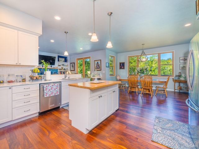217 Shoreline Dr, Negaunee, MI 49866 - kitchen featuring appliances with stainless steel finishes, butcher block countertops, dark wood finished floors, white cabinets, and recessed lighting