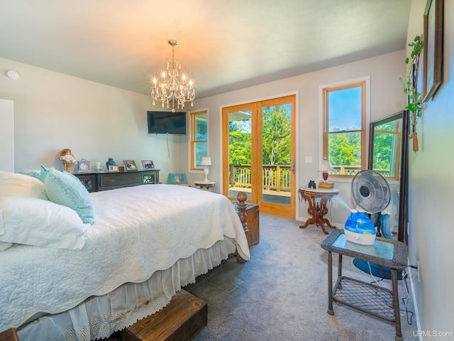 217 Shoreline Dr, Negaunee, MI 49866 - bedroom with access to outside, carpet, a chandelier, and baseboards