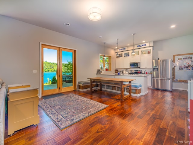 217 Shoreline Dr, Negaunee, MI 49866 - kitchen featuring appliances with stainless steel finishes, white cabinetry, light countertops, recessed lighting, and dark wood finished floors