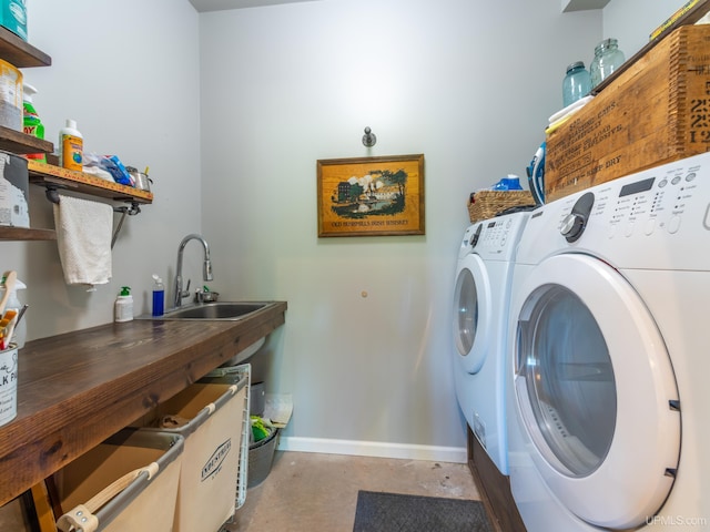 217 Shoreline Dr, Negaunee, MI 49866 - laundry room featuring washing machine and clothes dryer and baseboards