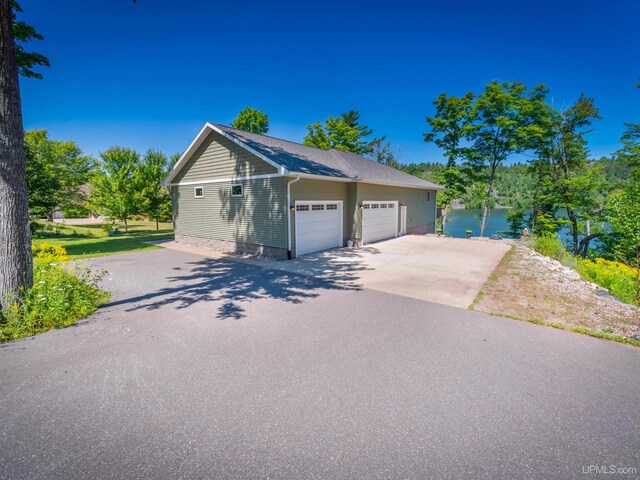 217 Shoreline Dr, Negaunee, MI 49866 - detached garage featuring a water view