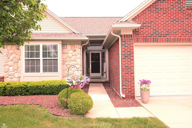 52834 Sable Dr, Macomb, MI 48042 - property entrance featuring an attached garage, roof with shingles, brick siding, stone siding, and concrete driveway