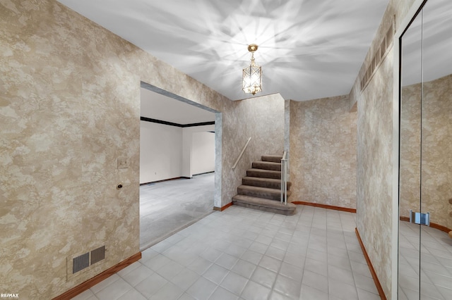 39067 Baroque Blvd, Clinton Township, MI 48038 - staircase featuring baseboards and a chandelier