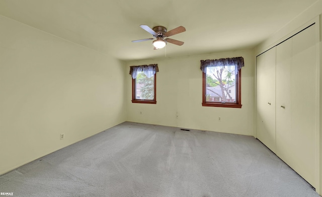39067 Baroque Blvd, Clinton Township, MI 48038 - unfurnished bedroom with light colored carpet, a closet, and ceiling fan