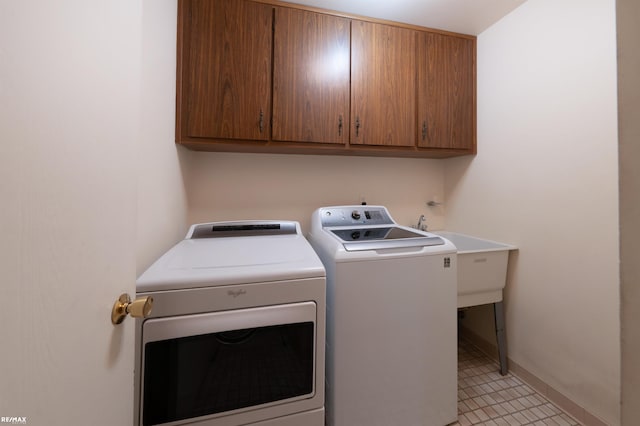 39067 Baroque Blvd, Clinton Township, MI 48038 - laundry area featuring washing machine and clothes dryer, cabinet space, and baseboards